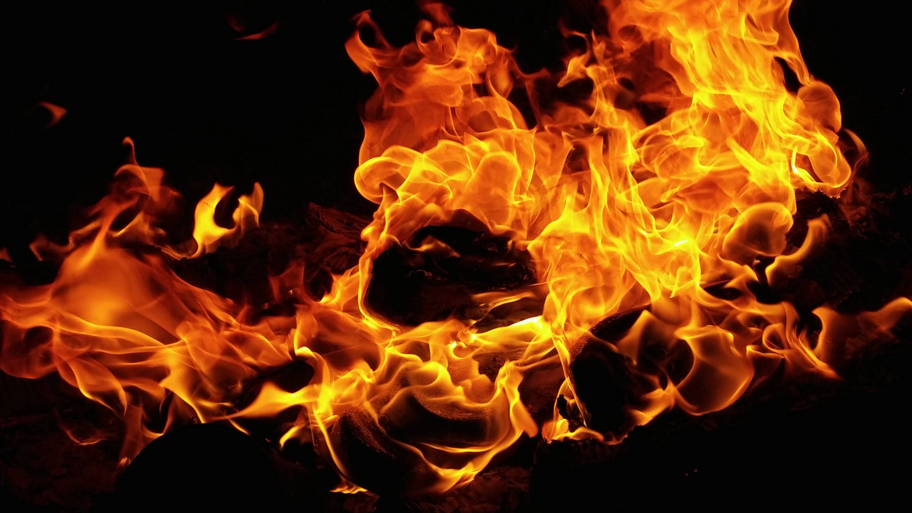 Image of orange flames set against a black background.