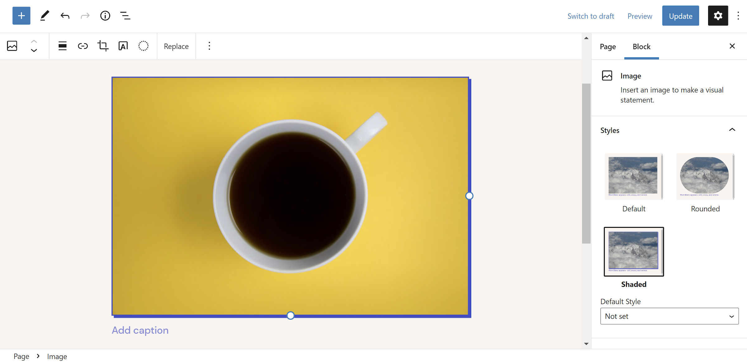 Blue drop-shadow on an image of a coffee in a mug in the WordPress editor.